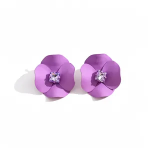 Purple matte spray-painted flower stud earrings with square purple crystal center