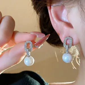 Elegant French design pearl drop earrings with oval zircon pavé and silver needle