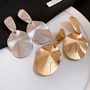 Minimalist glossy oval metal drop earrings in gold and silver finishes for women