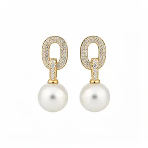Elegant gold-plated oval stud earrings featuring zircon pavé and hanging white pearls.