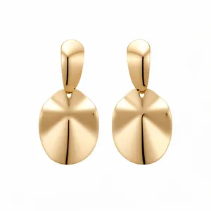 Elegant gold polished metallic oval dangle earrings featuring a minimalist and modern design