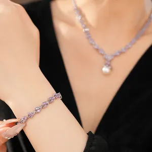 Elegant purple zircon vine bracelet and matching pearl necklace set shown on a model