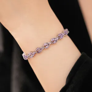 Detail shot of an elegant silver bracelet with marquise-cut purple zirconia stones