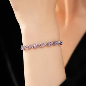 High-end elegant bracelet with marquise-cut purple zircons shown on a female model's wrist