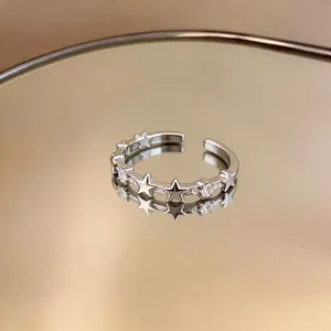 Elegant silver star open ring featuring sparkling zircons with a polished finish