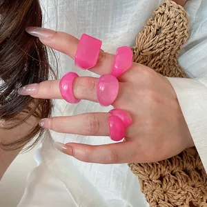 Detailed view of trendy pink candy resin rings set worn on hand for women's fashion