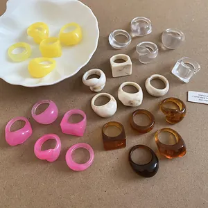 Detailed view of trendy candy-colored resin chunky rings in assorted geometric shapes