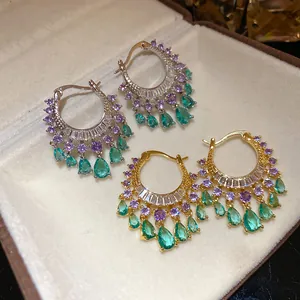 Elegant zircon hoop earrings with purple and green teardrop pendants in jewelry box