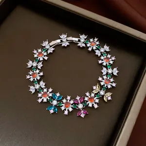 Detailed view of a vintage multi-color flower bracelet with sparkling zircons
