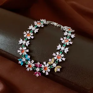 Detailed view of colorful floral zircon bracelet on premium brown display stand
