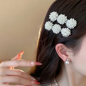 Elegant French style pearl hair clips worn on side hair, minimalist duckbill clips accessory