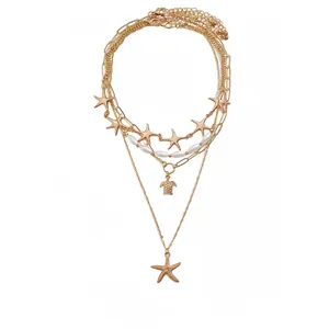Bohemian gold-tone starfish and turtle multi-layer necklace set with faux pearls