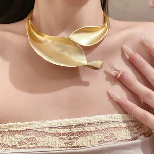 Close-up of a vintage matte gold leaf choker necklace for women's elegant jewelry collection