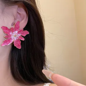Elegant oversized pink flower stud earrings with gold drip oil detail for women