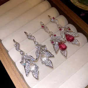 Silver needle zircon earrings with water drop leaf pendant design in a jewelry box