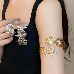 Elegant metal starfish and shell arm cuff bracelet in gold and silver finish