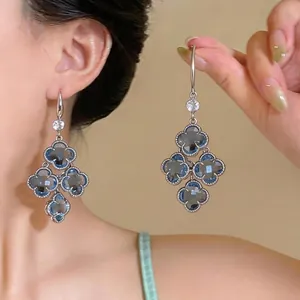 Elegant vintage-style zircon floral drop earrings with a delicate silver-tone finish.
