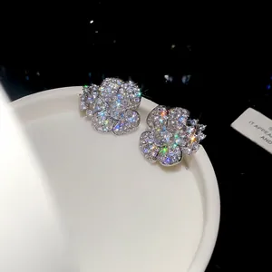 Close-up detail of luxury sparkling cubic zirconia flower stud earrings for women