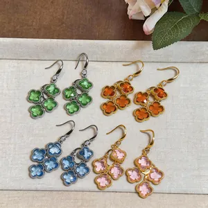 Close-up detail of elegant retro zircon flower drop earrings in various vibrant colors