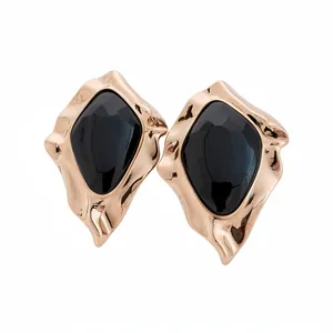 Elegant retro irregular geometric gold stud earrings with faceted black resin inlay