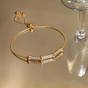 Detailed close-up of a vintage gold bamboo-shaped bracelet with sparkling zirconia stones
