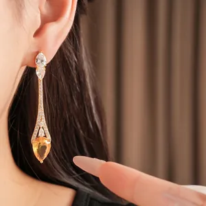 Eleganti orecchini a goccia placcati in oro 18 carati con zircone giallo e cristalli pavé
