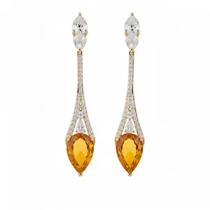 Eleganti orecchini a goccia placcati oro 18 carati con zirconi arancioni brillanti.