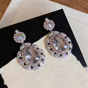Elegant teardrop crystal chandelier earrings with marquise-cut accents and floral details.
