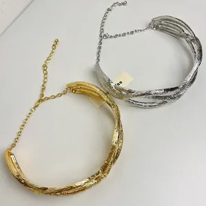 Minimalist elegant textured twisted metal choker necklaces in gold and silver finishes