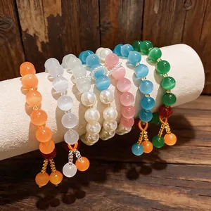 Eleganti braccialetti con perline occhio di gatto multicolore e ciondoli pendenti