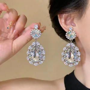 Close-up detail of palace style teardrop earrings with sparkling crystal diamonds
