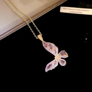 Detailed view of a gold-plated butterfly necklace with purple zircon crystals.