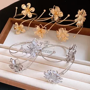 Minimalist metal floral arm cuffs with wrinkled flower design in gold and silver