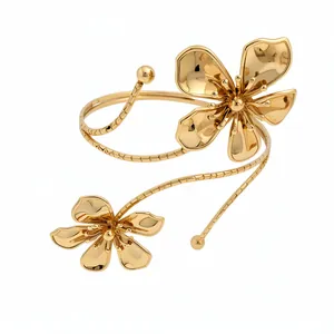 Elegant gold pleated flower arm cuff bracelet with a minimalist chic bohemian design