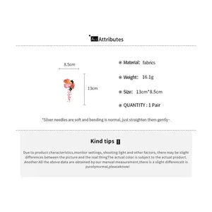 Detail of pink lily of the valley tassel hair clip with size and material info