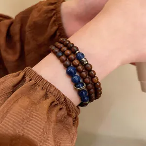 Vintage ethnic style layered bracelet with wooden and blue stone beads
