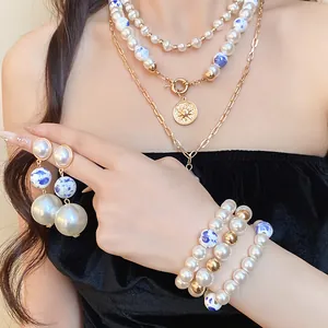 Vintage pearl and porcelain bead jewelry set with elegant sun pendant necklace