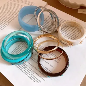 Colorful collection of Bohemian retro resin and metallic bangles for vintage style