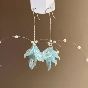 Elegant light blue petal earrings with sparkling zircon and pearl tassels.