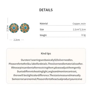 Detail view of vintage French gold-plated flower stud earrings with 2.2cm size specs