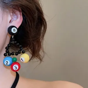 Unique handmade black triangle beaded earrings featuring colorful billiard ball charms