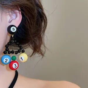 Close-up of billiard ball beaded triangle drop earrings with numbered details
