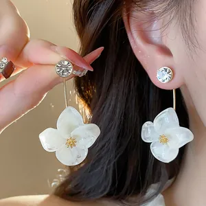 Elegant 18k gold plated resin flower stud earrings with sparkling crystals for women