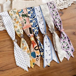 Elegant resort style fabric necklaces featuring various floral patterns and resin charms