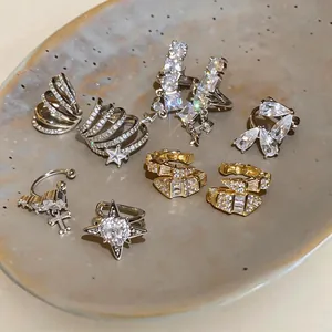 Collezione squisita di orecchini a clip in zircone con stelle e croci per donne eleganti.