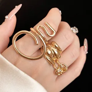 Chunky gold-plated hollow oval wrap ring for index finger, minimalist statement jewelry