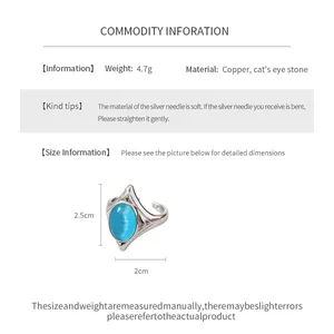 Product specification detail for geometric open ring with blue cat's eye stone.