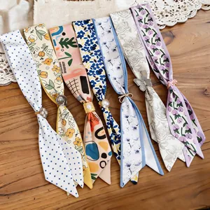 Assorted floral fabric choker necklaces with decorative resin charms and patterns