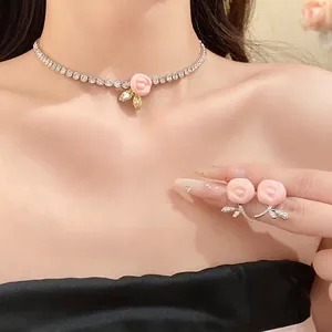 Elegant sparkly zircon resin rose flower choker necklace and earrings set on model