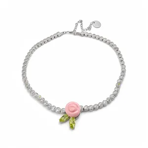 Elegant silver tennis necklace featuring pink resin rose pendant and green zircon leaves